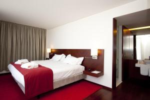 Cama ou camas em um quarto em Pousada De Viseu