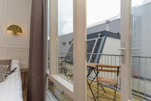 a balcony with a view of a building at Novallure City Centre in The Hague