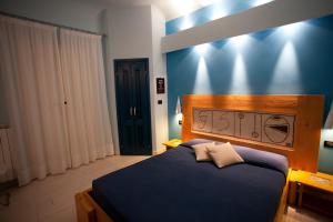 Postel nebo postele na pokoji v ubytování Locanda dei Poeti Rooms & Apartments