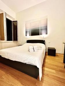 Un ou plusieurs lits dans un hébergement de l'établissement Appartamento centro Firenze AIR CONDITIONING WI-FI E NETFLIX