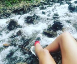 a person is sitting on a raft in a river at Faera Hostel in Darién