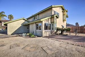 a house with two metal plates in front of it at Breeze By the Pool Retreat with Game Room! in Chula Vista
