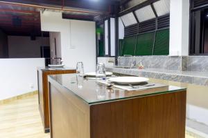 a kitchen with a counter with a plate on it at Cinnamon Tan Boutique Hotel in Negombo