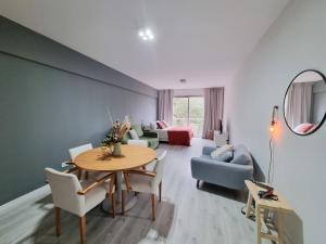 a living room with a table and a couch at iDeal Concord Pilar Aparts in Pilar