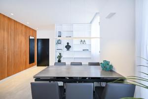 a dining room with a table and chairs at Sweet Home by HolyGuest in Tel Aviv