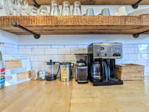 a coffee maker sitting on top of a counter at HostWise Stays - Industrial Vintage Style, Minutes to Downtown in Pittsburgh