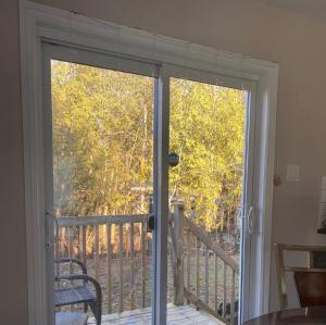 a sliding glass door with a view of a balcony at Beautiful 3 bedroom house in Ottawa