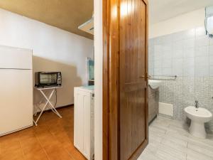 a bathroom with a toilet and a sink at VILLA CLAUDIO e LUNETTA in Villasimius