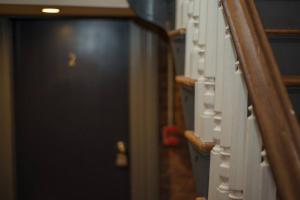 a close up of a hallway with a door at HostWise Stays - The Ohioan - Beautiful Brick Apt, Minutes to Downtown! in Pittsburgh