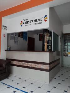 a lobby with a sign for a christian hospital at Hostal Don Cristobal in Ayacucho