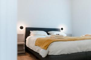 a bedroom with a large bed with a brown blanket at Apartment The City in Ghent