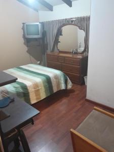 Cama ou camas em um quarto em LA CASA DE SYLVANA