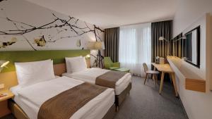 Cama ou camas em um quarto em Holiday Inn Frankfurt - Alte Oper by IHG