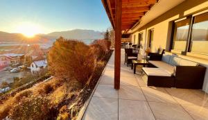 a balcony of a house with a view of the mountains at Appartement FELIX in Mariapfarr