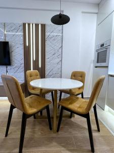a dining room with a table and chairs at PLEASURE LUX GOLD in Kopaonik