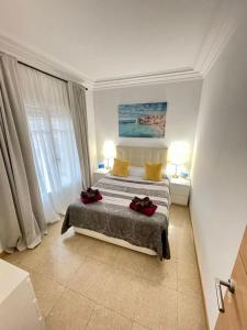 a bedroom with a bed and a large window at Nuevo Balmes Habitaciones in Barcelona