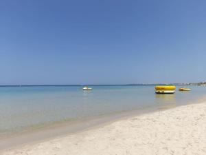a group of boats in the water on a beach at Sahline, entre Sousse et Monastir, 2 Km de la plage in Sahline