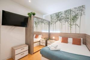 A bed or beds in a room at Espíritu Santo, comodidad para 2 en Malasaña