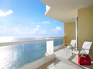 a balcony with a view of the ocean at Acqualina Resort and Residences in Miami Beach