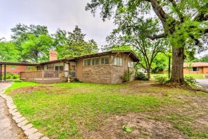 a house with a tree in front of it at Restful Winnsboro Family Home Walk to Main Street in Winnsboro