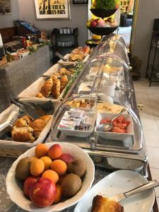 a buffet line with many different types of food at Hôtel Le Pré Catelan in Juan-les-Pins
