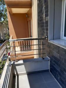 a balcony with a wooden bench next to a window at Appartement haut standing a louer Petit déjeuner inclu in Tangier