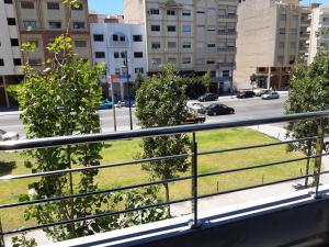 a balcony with a view of a city street at Appartement haut standing a louer Petit déjeuner inclu in Tangier