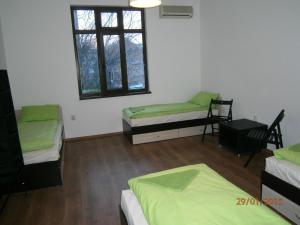 Кровать или кровати в номере Ivory Tower Hostel
