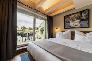 The Viaduct - Suites & More客房内的一张或多张床位
