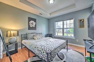 a bedroom with a bed and a window at Uptown Charlotte Townhome with Hot Tub in Charlotte