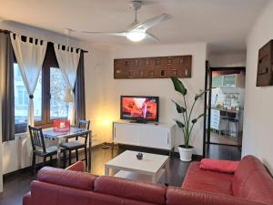 a living room with a couch and a table at Badalona playa Barcelona in Badalona