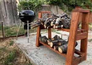 a pile of fire wood next to a pile of logs at Comfy stay in private 2beds, 1bath kitchen RV in Escondido