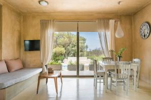 a living room with a table and a couch at Sotiris villas in Svoronata