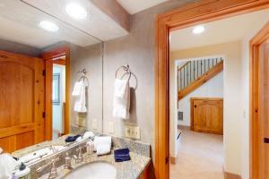 a bathroom with a sink and a mirror at Aspen Ridge 21 - Mountain Village Magnificence in Telluride +23 photos