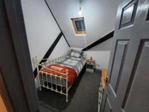 Ein Bett oder Betten in einem Zimmer der Unterkunft The Olde Chapel 2 Bedroom Flat