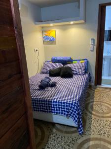 Una cama o camas en una habitación de JARDIM ITAMAMBUCA