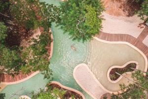 an overhead view of a river with a pool at Oriundo Luxury Nature Villas in Valladolid