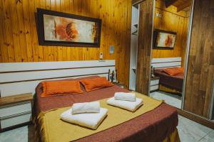 Postel nebo postele na pokoji v ubytování Cabañas Riberas del Paraná + 37 fotografií