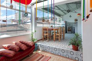 a living room with a couch and a table at Magic Cusco in Cusco