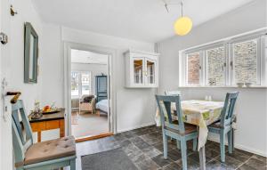 a kitchen and dining room with a table and chairs at Amazing Apartment In Aabenraa With Wifi in Aabenraa