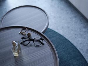 a pair of glasses sitting on top of a table at FAV TOKYO Nishinippori in Tokyo