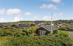 a house on a hill in a suburb at Lovely Home In Lgstr With Kitchen in Løgstør