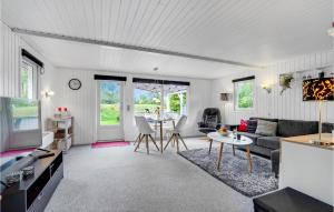 a living room with a couch and a table at Gorgeous Home In Ulfborg With Wifi in Ulfborg