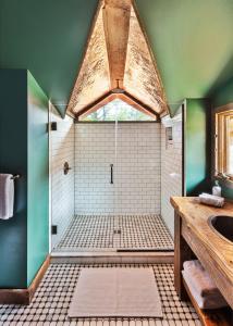 a bathroom with a shower and a sink at Urban Cowboy Lodge in Big Indian