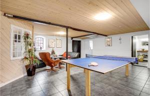 a living room with a ping pong table in it at Awesome Apartment In Esbjerg V With Wifi And 1 Bedrooms in Esbjerg