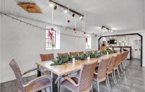 a long dining room with a long table and chairs at Gorgeous Apartment In Esbjerg V in Esbjerg