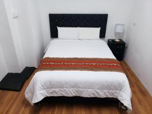 Letto o letti in una camera di Hostal Cusco de mis Sueños
