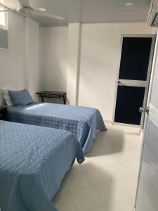 Postel nebo postele na pokoji v ubytování Hostal La Princesa