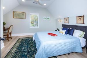 a bedroom with a large bed with a red tray on it at Heart of Brevard Hideaway - Walk/Bike to Downtown! in Brevard