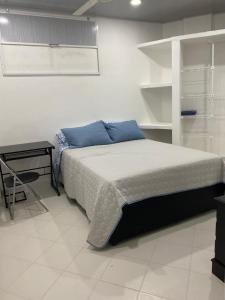 Postel nebo postele na pokoji v ubytování Hostal La Princesa